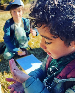 Student participating in hands-on outdoor learning activity