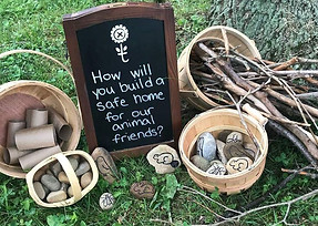 Kids making nature crafts at Wild Wander Forest School camp